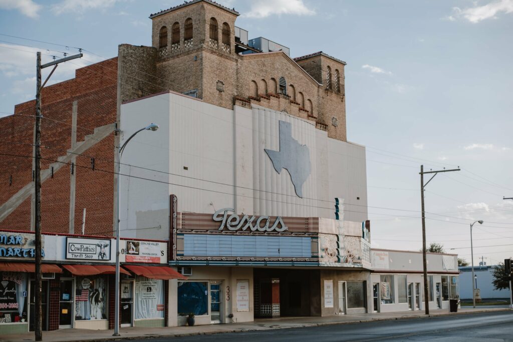Photo of a movie theater with Texas on the marquee